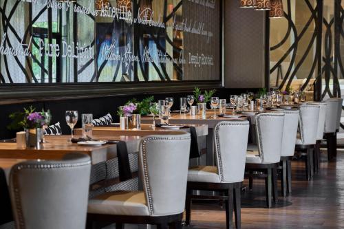 a row of tables and chairs in a restaurant at Renaissance Asheville Downtown Hotel in Asheville