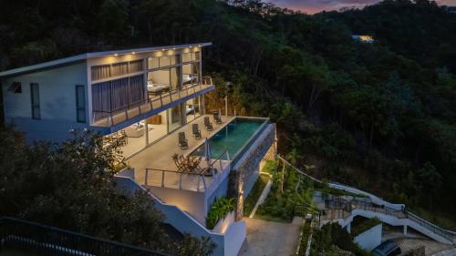 an aerial view of a house with a swimming pool at TWO SISTERS HILL Villa - Spectaculaire vue sur mer in Koh Samui
