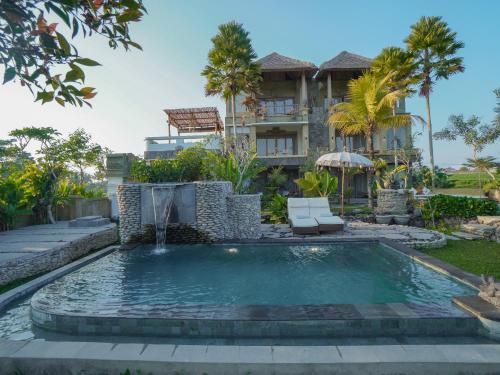 a swimming pool in front of a house at The Nenggala Suite in Tegalalang