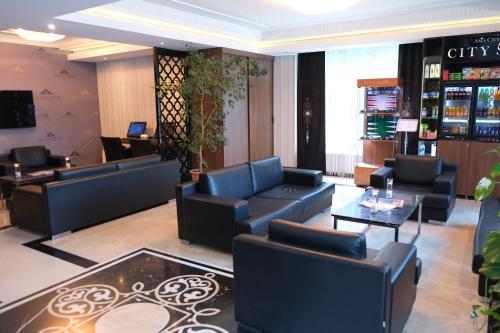 a waiting room with couches and tables in a salon at Asia City Hotel Istanbul in Istanbul