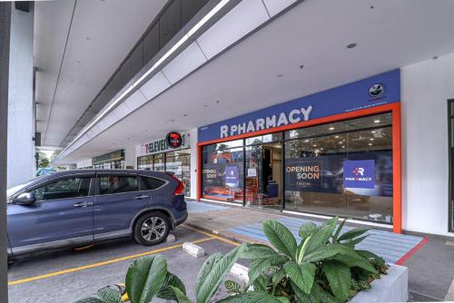 a blue car parked in front of a store at 10 min to My town family unit By Nexx Field in Kuala Lumpur