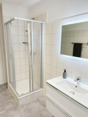 a bathroom with a shower and a sink at Alte Försterei 2.0 in Thale