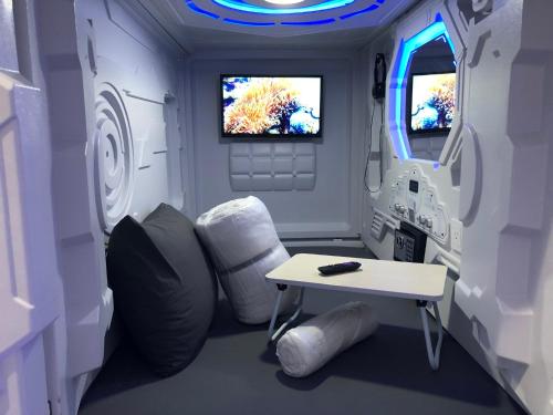 a room with a table and a chair in an ambulance at PODLIFE in Los Angeles