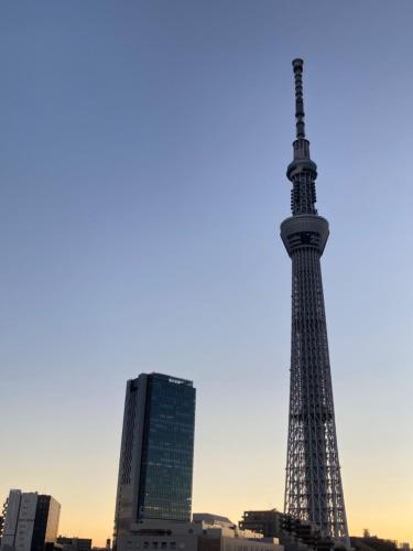a view of the eiffel tower in a city at Sky Tree INN (晴樹宿）stay ASAKUSA in Tokyo
