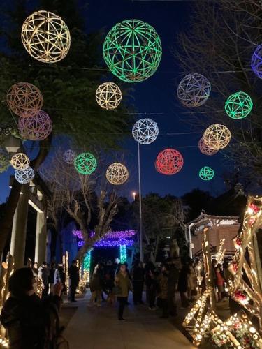 a group of lights hanging over a street at night at Sky Tree INN (晴樹宿）stay ASAKUSA in Tokyo