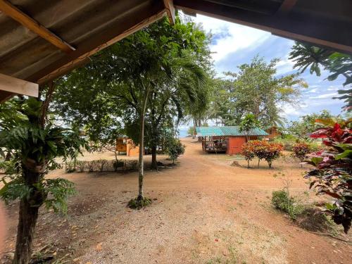 a view of a village with a tree and a building at Koh Mak Green View Resort in Ko Mak