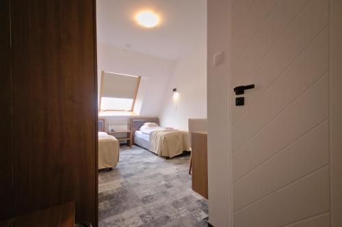 Ένα ή περισσότερα κρεβάτια σε δωμάτιο στο Hotel Sezam