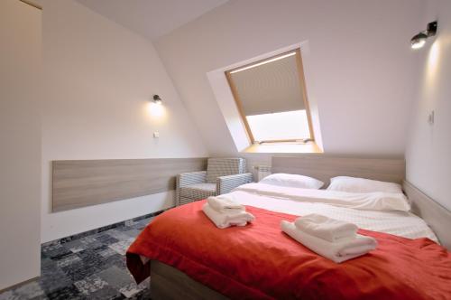 Ένα ή περισσότερα κρεβάτια σε δωμάτιο στο Hotel Sezam
