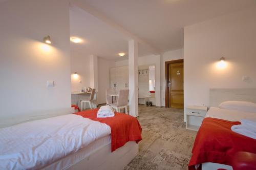 Ένα ή περισσότερα κρεβάτια σε δωμάτιο στο Hotel Sezam