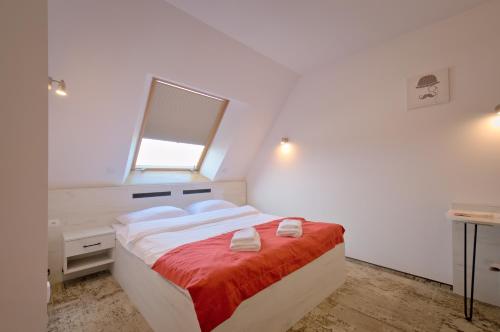 Ένα ή περισσότερα κρεβάτια σε δωμάτιο στο Hotel Sezam