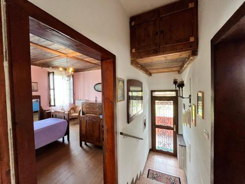 a hallway with a room with a bed and a door at Ca' De Franceschi in Teolo