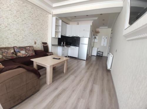 a living room with a couch and a table at Meskheti Tower Unit 93 in Akhaltsikhe