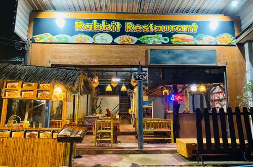 a restaurant with a sign that reads rabkrit restaurant at Baan phuwamin in Ko Lanta