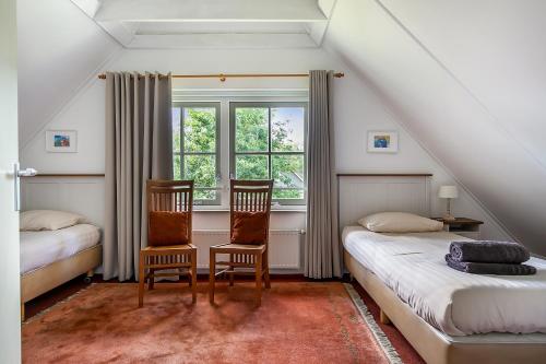 מיטה או מיטות בחדר ב-De Appelhoeve