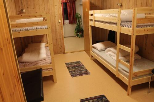 Säng eller sängar i ett rum på Feriested i Tørberget