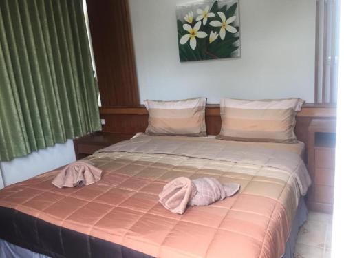 Postel nebo postele na pokoji v ubytování Praew Guesthouse