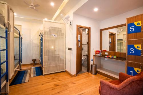 a room with a bathroom with a shower in it at Shalom Backpackers Mussoorie in Mussoorie