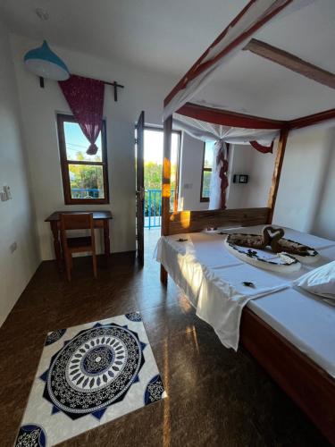 Postel nebo postele na pokoji v ubytování Sabali Lodge, Zanzibar
