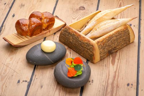a table with bread and different types of food at Forest Side Hotel in Grasmere