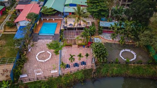 an aerial view of a house with a swimming pool at Dandeli Jungle Resort in Dandeli
