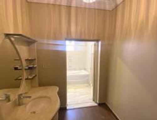 a bathroom with a toilet and a sink and a shower at العنوان للشقق المخدومة ALanwaan of the units served in Dammam