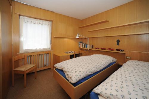 Ένα ή περισσότερα κρεβάτια σε δωμάτιο στο APPARTAMENTO FIEMME