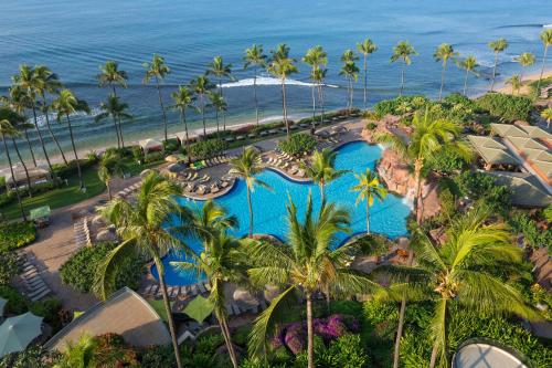 an aerial view of a resort with palm trees and the ocean at Hyatt Regency Maui Resort & Spa in Lahaina
