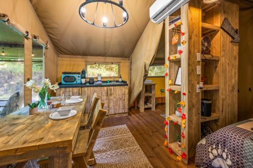 a dining room and kitchen in a tiny house at Firefly Season Glamping in Sevierville