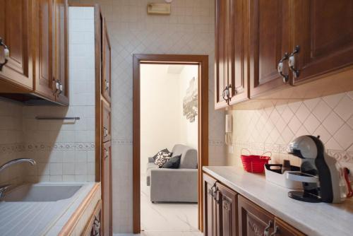 a kitchen with a door leading to a living room at Sweet home Q.S in Naples
