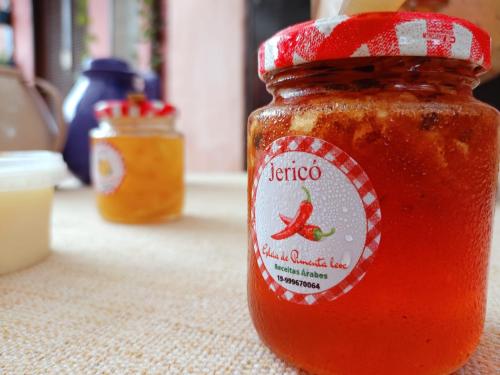 a jar of tomato sauce sitting on a table at Vila Santa Rosa in Ilhabela