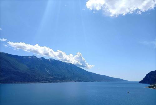 a view of a large body of water with mountains at Centro Vacanze La Limonaia in Limone sul Garda