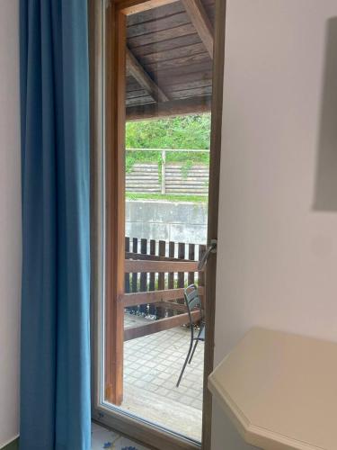 a sliding glass door with a view of a deck at Il Barbacane in Bacoli