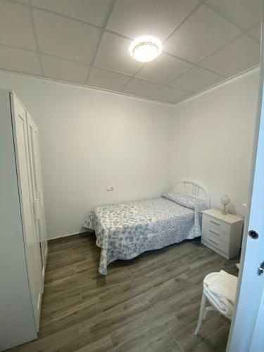 Łóżko lub łóżka w pokoju w obiekcie Apartamento Gabarron