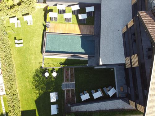 an overhead view of a yard with a swimming pool at Montanaris Alpine - Active - Relax in Villabassa