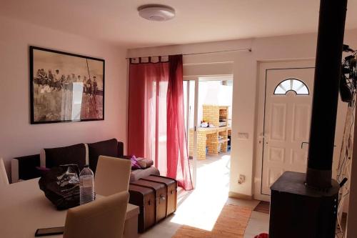 a living room with a couch and a fireplace at CasaSanPaulo1 in Montijo