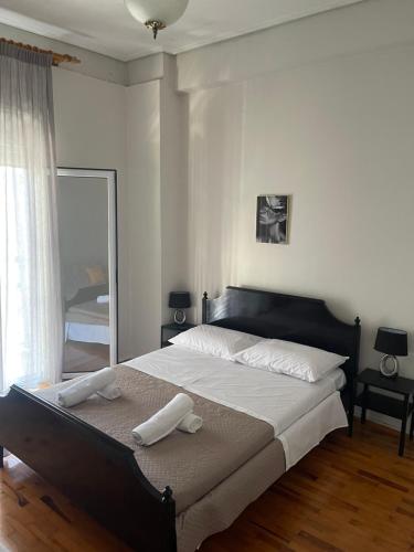 Postel nebo postele na pokoji v ubytování Rooms fbΓιώργος Πιπερης