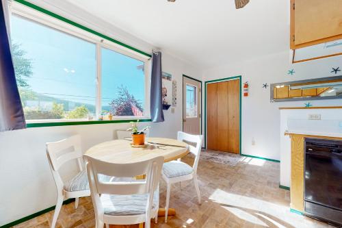 a dining room with a table and chairs and a fireplace at Mom’s Mountain View in Somers