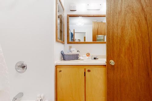 a bathroom with a sink and a mirror at Mom’s Mountain View in Somers