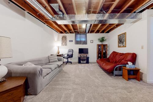 a living room with a couch and a chair at Mom’s Mountain View in Somers