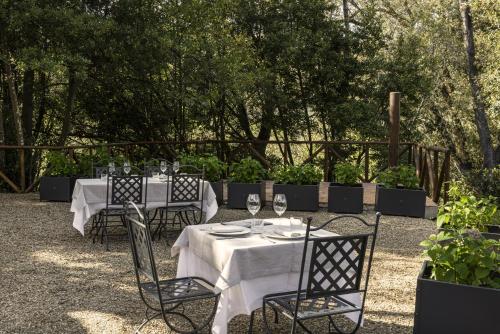 a group of tables with wine glasses on them at Casavilla Rentals by Torre a Cona in Rignano sullʼArno