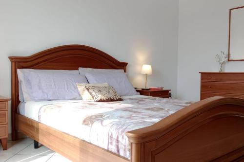 מיטה או מיטות בחדר ב-Comodo bilocale a Brandizzo
