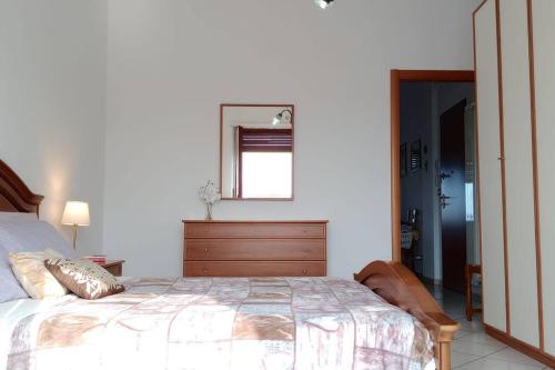 מיטה או מיטות בחדר ב-Comodo bilocale a Brandizzo