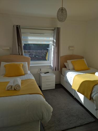 Postel nebo postele na pokoji v ubytování Anchorage Guest House - Also 1 room available with Hot Tub,must be booked separately
