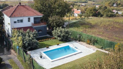 an aerial view of a house with a swimming pool at Boom House Fruska Gora in Irig