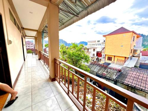 a balcony with a view of a city at Vang Vieng Global Hostel in Vang Vieng