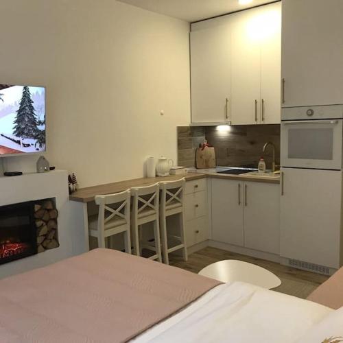 Η κουζίνα ή μικρή κουζίνα στο G Apartments Milmari Resort & Spa (Lux)