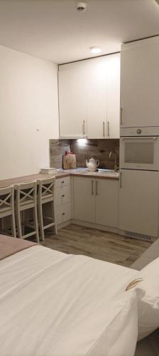 Η κουζίνα ή μικρή κουζίνα στο G Apartments Milmari Resort & Spa (Lux)