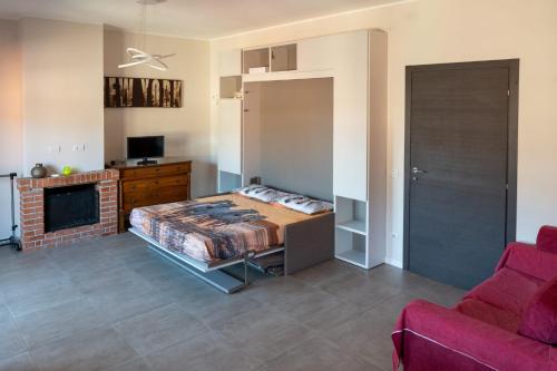 a bedroom with a bed and a fireplace at Milano primaticcio - Monolocale in Milan