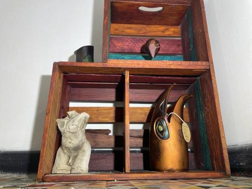 a wooden box with a statue of an elephant at Casa Bianca in Bogotá