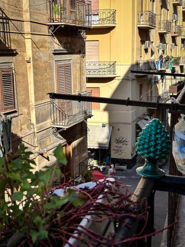 a view of a city street with buildings at Palazzo Maqueda in Palermo